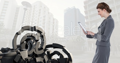 Broken concrete stone with at symbol and businesswoman in cityscape