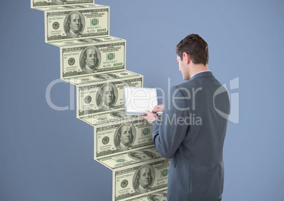 texting money. Businessman with laptop (back), going up the money stairs