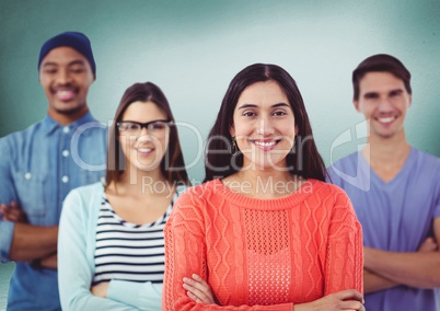 Millennial team smiling against green room