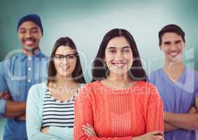 Millennial team smiling against green room