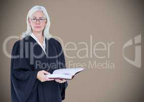 Female judge with open book against brown background