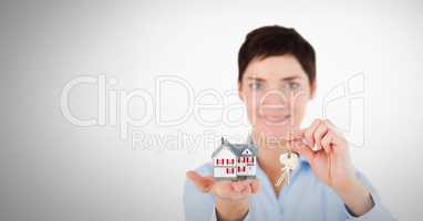Woman holding key in front of Vignette