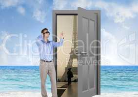 businessman with VR glasses in the beach with door to go to Paris