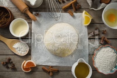 Overhead view of kneaded dough amidst various ingredients