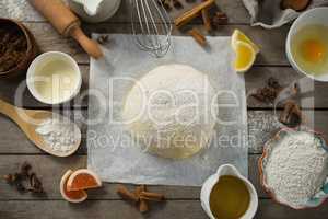 Overhead view of kneaded dough amidst various ingredients