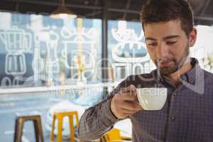 Businessman having coffee in cafe