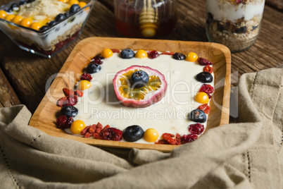 Various fruit cereals on a wooden table