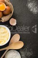 Overhead view butter by eggs in bowl