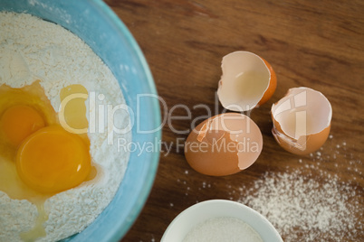 Close up of egg and flour in bowl