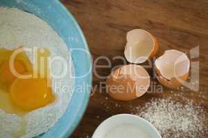 Close up of egg and flour in bowl