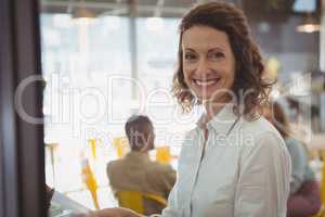 Portrait of happy woman in cafe