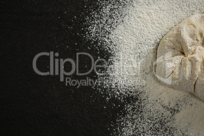 Cropped image of flour on dough