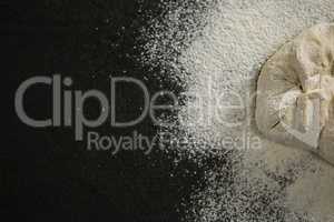 Cropped image of flour on dough