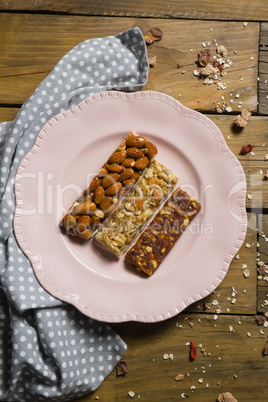 Three dry fruits bars arranged in plate
