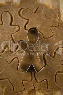 Gingerbread man pastry cutter on dough