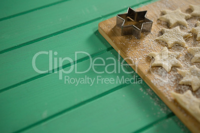 High angle view of star shape cookies on cutting board