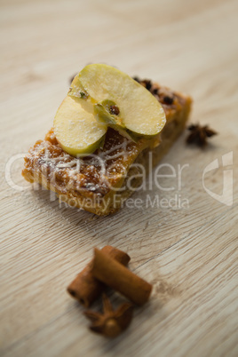 High agnel  view of apple slice on dessert by spice