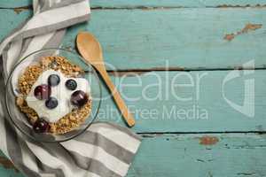 Bowls of breakfast cereals and fruits with yogurt