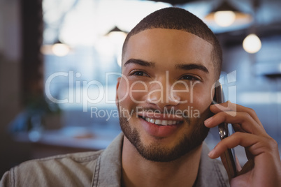 Close-up of man talking on phone