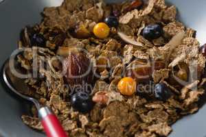 Wheat flakes with blueberry and golden berry in bowl