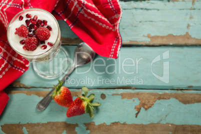 Cup of yogurt with raspberry and pomegranate