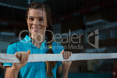 Portrait of happy female volleyball player