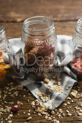 Jar with dates on wooden table
