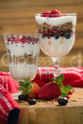 Cup of cereals with fruits and yogurt