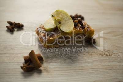 Close up of apple slice on dessert by spice