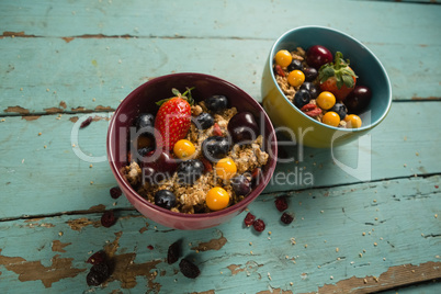Bowls of breakfast cereals and fruits