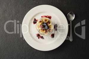 Fruit cereal in jar on concrete background