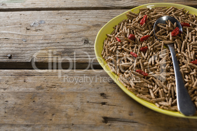 Cereal bran sticks with spoon in plate