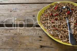 Cereal bran sticks with spoon in plate