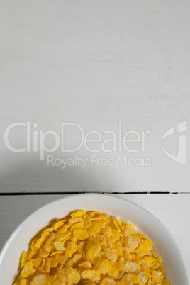 Breakfast cereals in bowl on a wooden table