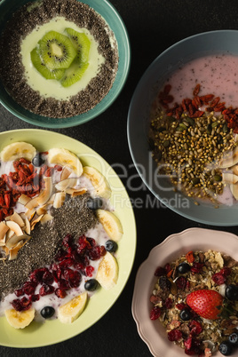 Various fruit cereals on concrete background