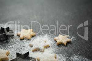 Close up of star shape cookies with pastry cutter