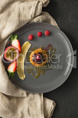 Healthy breakfast with fruits in a plate