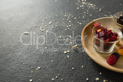Fruits and dried fruits in wooden plate