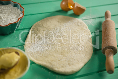 High angle view of dough with ingredients