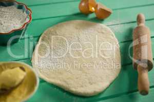 High angle view of dough with ingredients