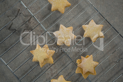 Close up of star shape cookies on cooling rack