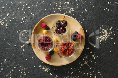 Fruits and dried fruits in wooden plate