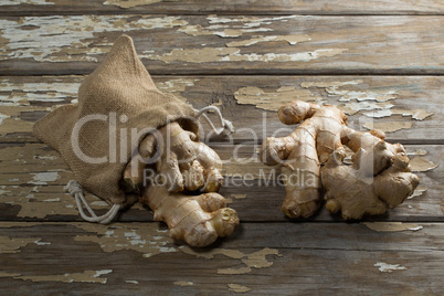High angle view of gingers with burlap on weathered table