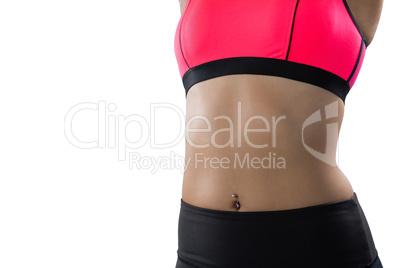 Mid section of female athlete in pink sports bra