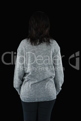Woman standing on black background
