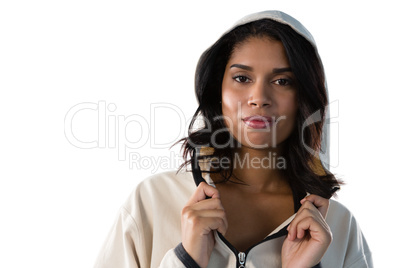 Portrait of female athlete wearing hooded jacket