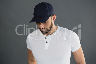 Handsome man posing against grey background