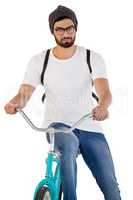 Handsome man posing with bicycle against white background