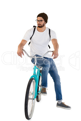 Man posing with bicycle against white background