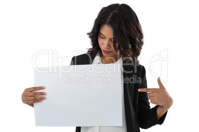 Businesswoman pointing at placard